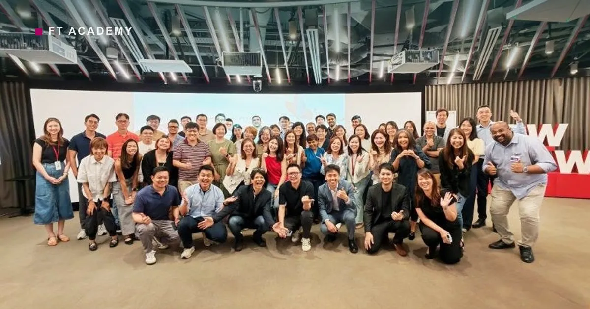 Participants and facilitators of the OCBC AI Community of Practice Demo Day gathered for a group photo in the OCBC Campus event space.