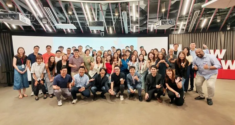 The full cohort of OCBC participants and facilitators gathered for a group photo at the end of the Demo Day.