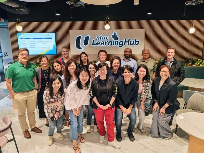 The HSBC COO office team with the FTA facilitators at the NTUC LearningHub campus after the AI applications masterclass.