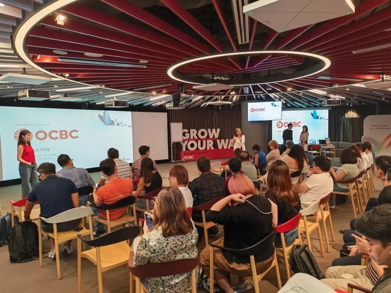 Attendees seated in the OCBC Campus space during a session, with OCBC and Grow Your Way branding on the screens.